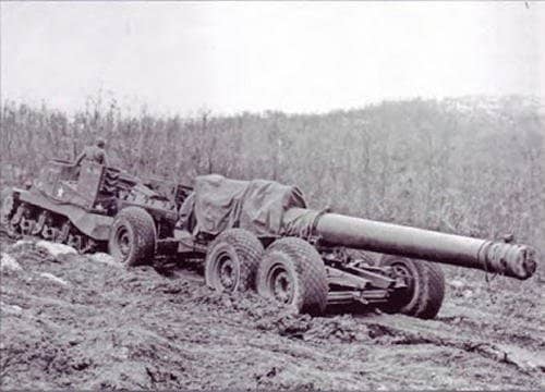 240mm gun being towed by M33 tractor, Italy 1943 or 1944. The barrel was transported separately and then hoisted by crane into the gun carriage once in position.