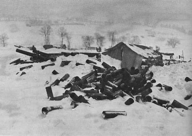 Empty shell casings near gun section, Elsenborn Ridge, 1944.
