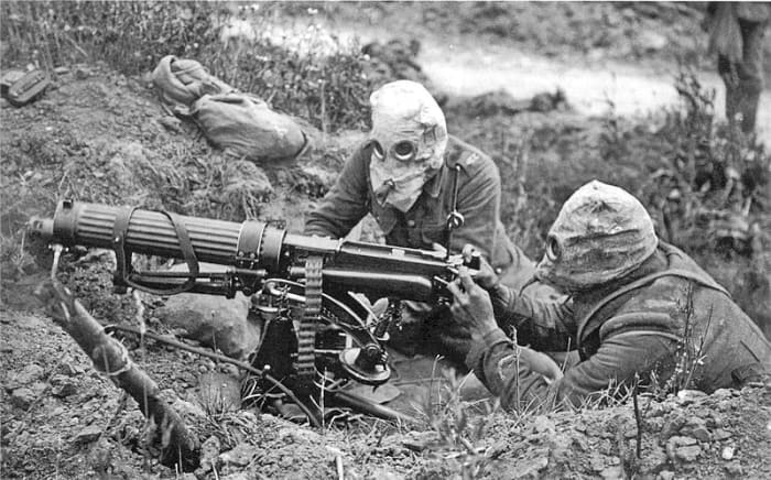 British troops wearing gas masks using the Vickers machine gun, one of the earliest examples of an automatic weapon at the battle of the Somme.