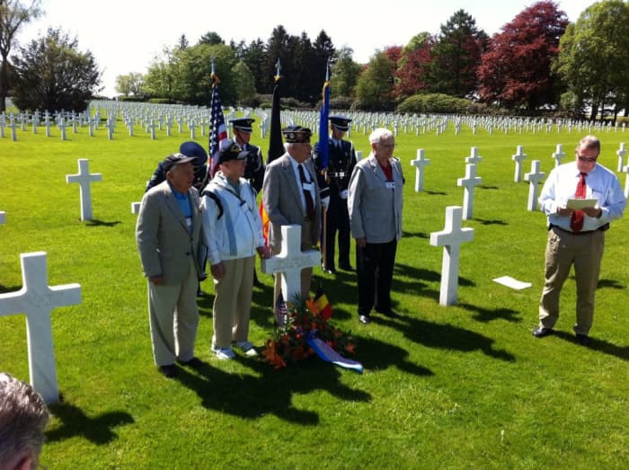 Veterans of the 106th ID along with a German veteran of the battle gather at Wood's grave for a ceremony in 2012. John Gatens is second from left.