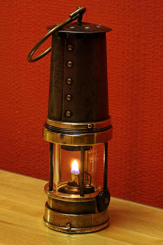 A Davy Lamp, invented by Sir Humphrey Davy who was president of the Royal Institution and became Michael Faraday's mentor.