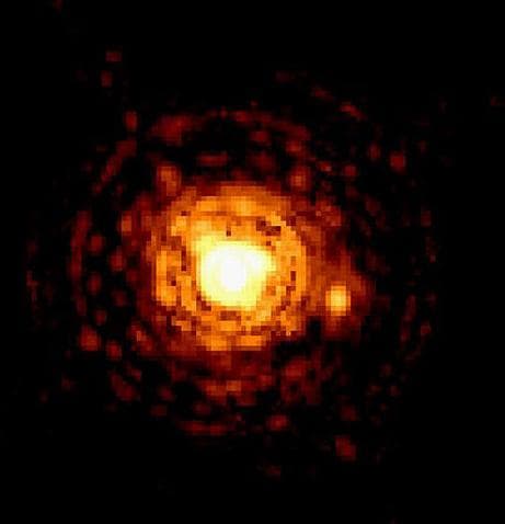 Binary red dwarf stars (Gliese 623) that are 26 light years from Earth. The smaller star is only 8% of the Sun's diameter.