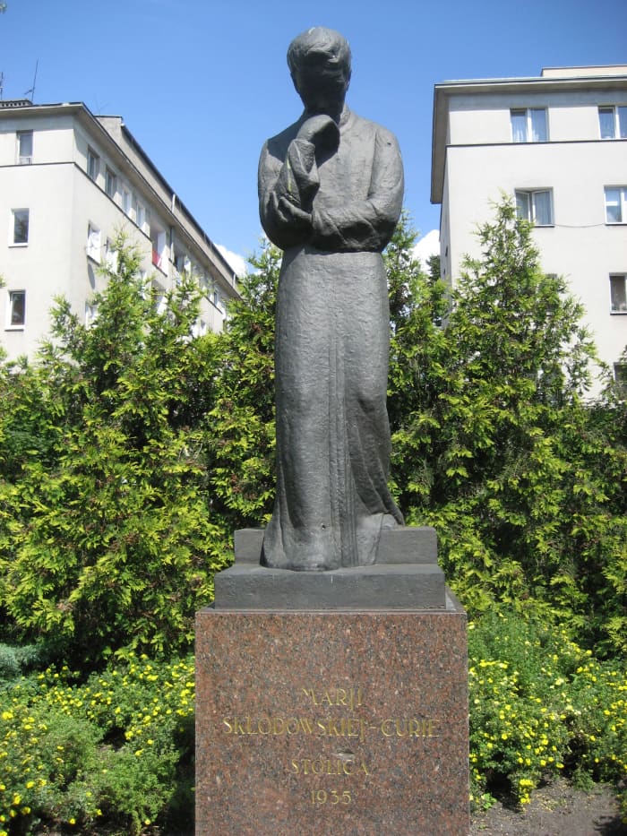 An approximately life-size statue of Maria Skłodowska-Curie (1867-1934), sculpted by Ludwika Nitschowa, erected in 1935 the statue faces the Radium Institute that she established.