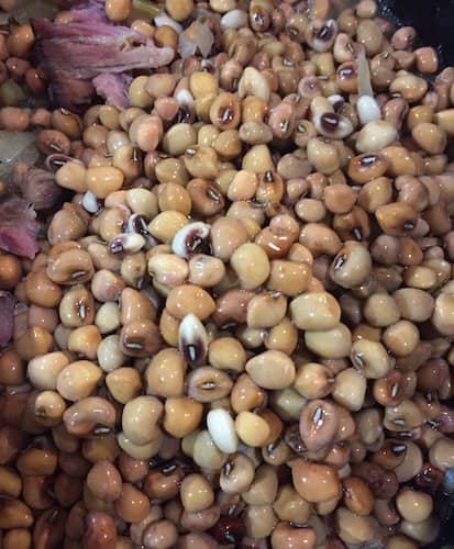 Black-eyed peas are one variety of cow peas. Traditionally these peas are seasoned with ham or bacon.