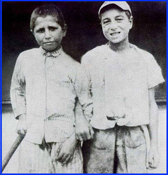 Here's Babe Ruth (on the right) at age seven, shortly after entering St. Mary's Industrial School for Boys.
