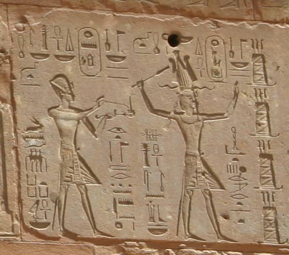 Hieroglyphs showing Thutmose III on the left and Hatshepsut on the right, she having the trappings of the greater role — Red Chapel, Karnak.