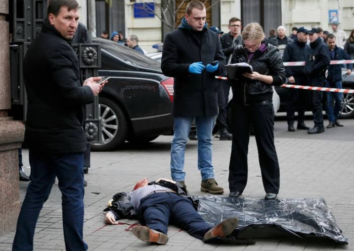 Ukraine detectives alledgedly investigate the death of Denis Voronenkov. Male detectives secretly play Criminal Case on their cell phones while the lady with the clipboard does the real work.