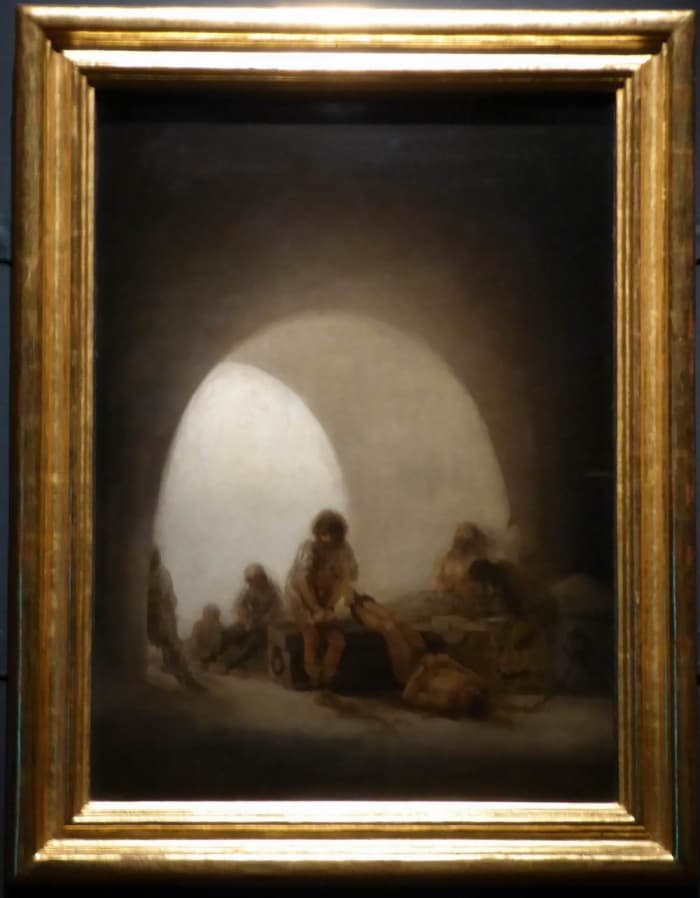 Goya shows us seven ghostly figures incarcerated in a dark, damp prison. Image by Frances Spiegel with permission from The Wallace Collection.