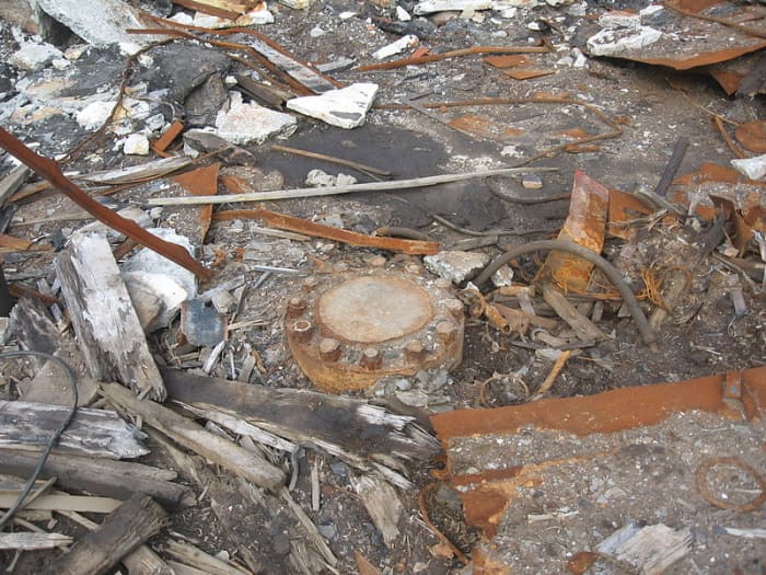 The borehole is firmly closed off with this metal cover. On it is written in white lettering, the numbers 12,226, the number of metres to which the holes sinks.