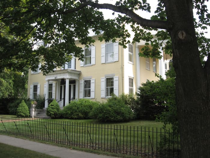 Home on corner of Ft. Hill and N. Main St. in Canandaigua, New York in whose front window a candle still glows in memory of the, now nameless, young man who left the home to fight in World War I and never returned