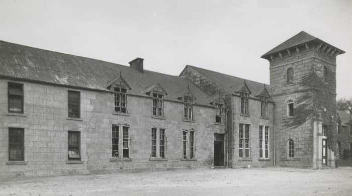 The main building in about 1948 showing the Boys' Boarding Department. The bell tower added in 1899 in memory of Matthew Blyth is to the right of the photo. The tower also held the bell donated by Nogaga.
