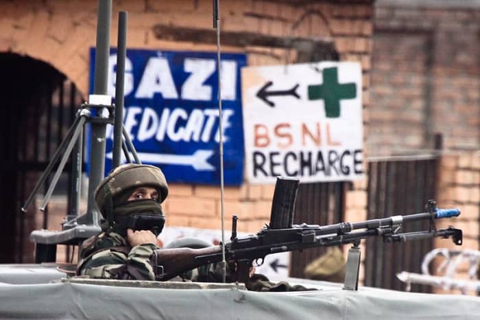 Indian soldier keeping watch near the Srinagar airport. Jammu and Kashmir have been the site of armed clashes between India and Pakistan several times. Image courtesy Jrapczak & Wikimedia Commons.