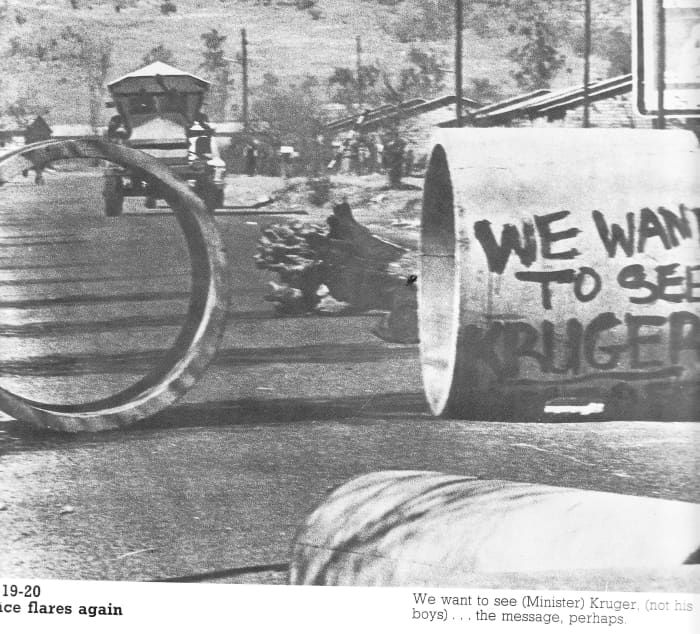 Blockades erected by students in their running war with the police and riot police who were by now ing military vehicles like the 'Hippo' seen in th background