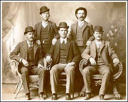 Sitting (l to r): Harry A. Longabaugh, alias the Sundance Kid, Ben Kilpatrick, alias the Tall Texan, Robert Leroy Parker, alias Butch Cassidy; Standing (l to r): Will Carver, alias News Carver and Harvey Logan, alias Kid Curry; Fort Worth, Texas, 190