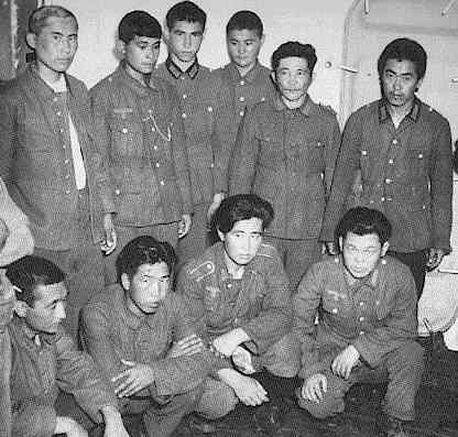 Korean soldiers dressed in German army uniforms. They were pressed into service by the Japanese, then the Soviets, then Germany, before being captured by Americans in France.