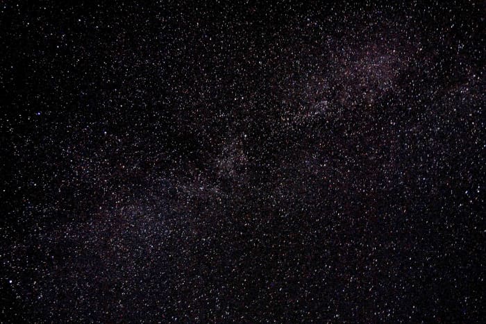 The light cloudy band crossing the photo from top right to bottom left is composed of billions of stars in the direction of the centre of our Galaxy, The Milky Way