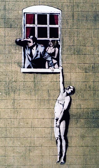 Banksy's image of a naked man on the wall of a sexual health clinic in Park Street, Bristol. The image was controversial, but following public support, the City Council decided not to remove it. Some other Banksy works have not been so lucky.