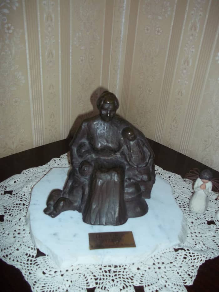 A bronze replica of the work of Joyce (nee Casorso) McDonald given to Muriel as a gift. Notice the three children in Rosa's arms...the arduous trip of coming to the New World is remembered.