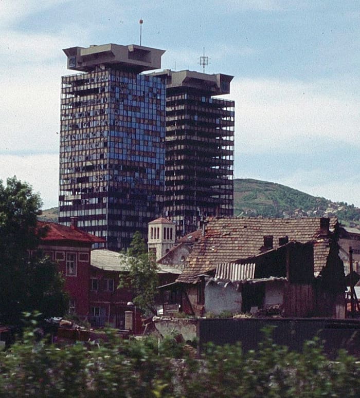 Shelled by tanks, the UNITIC Twin Skyscrapers in Sarajevo were heavily damaged during the siege. Affectionately called "Momo and Uzeir" (two characters in a comedy show-- a Serb and a Bosnian), they remained standing, becoming symbols of resilience.