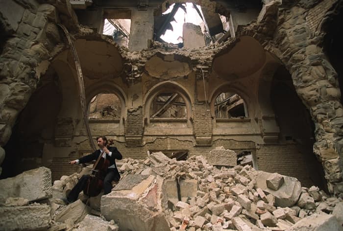 Cello player Vedran Smailovic plays in the partially destroyed National Library.