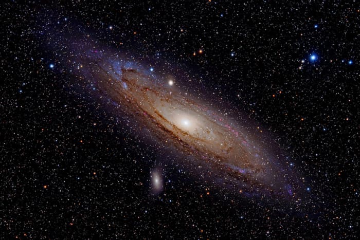 The Andromeda Galaxy. Sadly the galaxy will not look anything like this in binoculars! But this is what you are looking at when you see that fuzzy patch. Just left of centre are two attendant dwarf galaxies: M32 (above) and M110 (below).