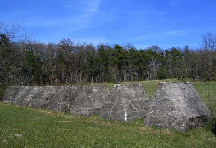 Part of the Toblerone line near Gland (Switzerland). Each block is taller than a man.