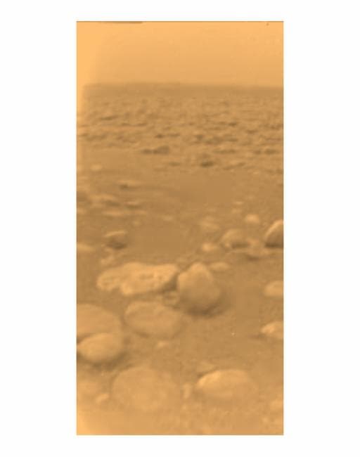 It doesn't look like much, but this photo from the surface of Titan is our first landing on a world beyond Mars -- 887 million miles from the Sun. A smoggy methane haze dominates. Pebbles are actually water ice, the "rock" on Titan.