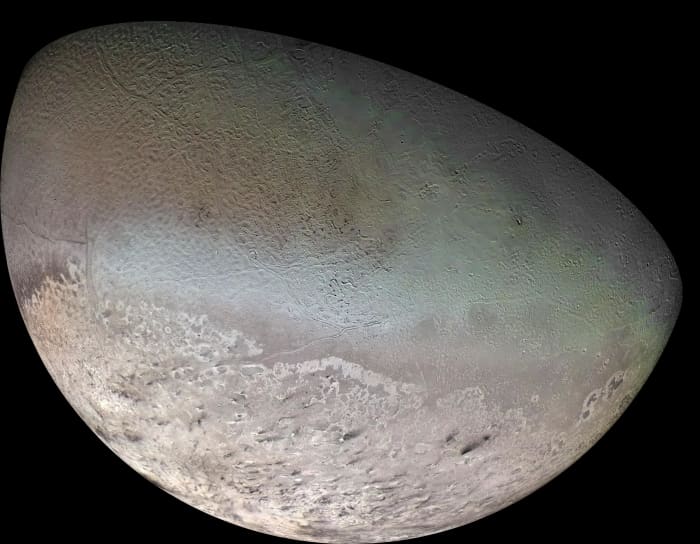 The southern half of Neptune's moon Triton: a world in deep-freeze with "cryovolcanoes" and features that still puzzle scientists.