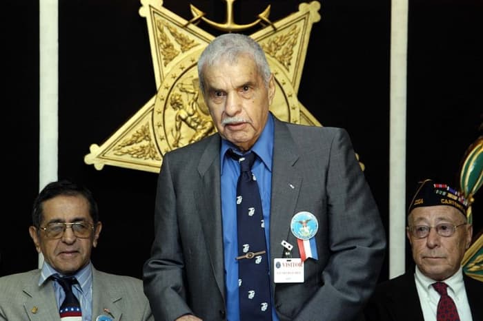 Marine veteran Guy Gabaldon wows the crowd with his impromptu comedy and his tales of valor from World War II at a Pentagon ceremony honoring Hispanic World War II veterans Sept. 15, 2004.