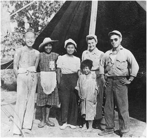 WWII: PFC Guy Gabaldon (right) poses with a few of the 1,500 Japanese soldiers and civilians who surrendered to him, during World War II.