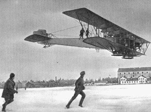 WWI: Four-engine Russian Ilya Muromets heavy bomber. Note the two men standing on the fuselage and the winter skis.