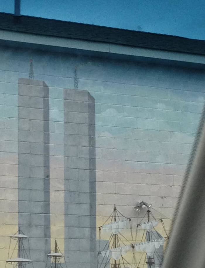 The Twin Towers painted on a building remind us that New York as been through other difficult times.