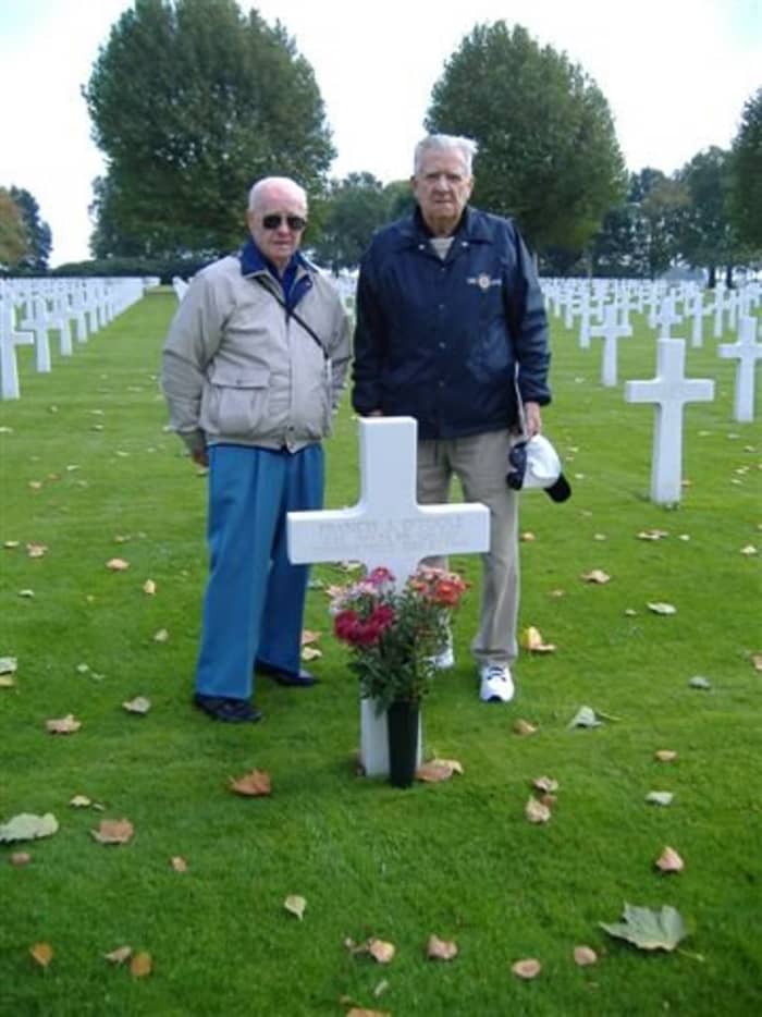 John Gatens (A btry) and John Schaffner (B btry) of the 589th Field Artillery visit the grave of Lt. Francis O'Toole (A btry). Both men were at Parker's Crossroads. Mr. Gatens was captured. Mr. Schaffner made a harrowing escape into the forest.