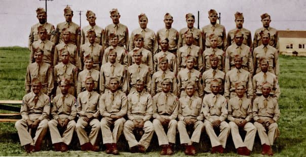 Battery A, 589th Field Artillery, Summer 1944. John Gatens is in the 2nd row, fifth from the right.