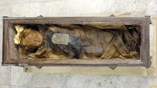 Rosalia inside her tiny glass coffin. Nobody has opened it since she was placed inside. Notice the lid shown in the photo above has been removed.