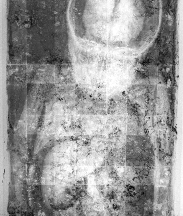 The x-ray of Rosalia showing her brain and liver intact. The grid is of the coffin beneath the body.
