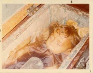 This photo taken in the 1970s of Rosalia. Notice the hinged wooden coffin lid to the left, which has since been removed. Only the glass lid remains.