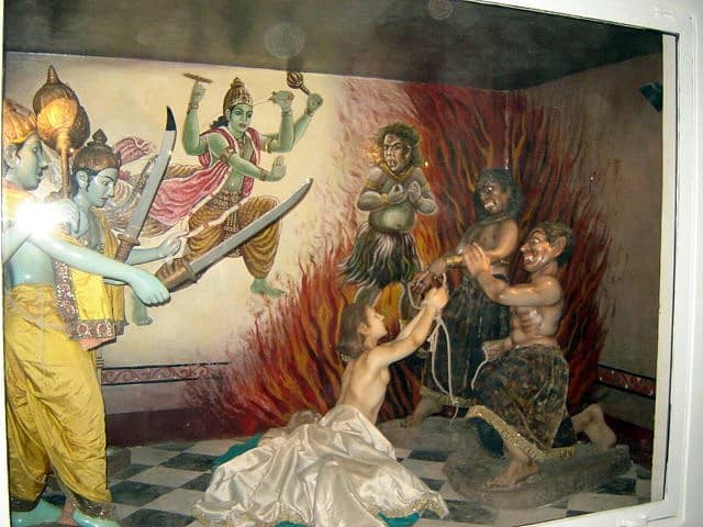 The depiction of the story of Ajamila where the messengers of Lord Vishnu arrive and save him from the messengers of the God of Death.