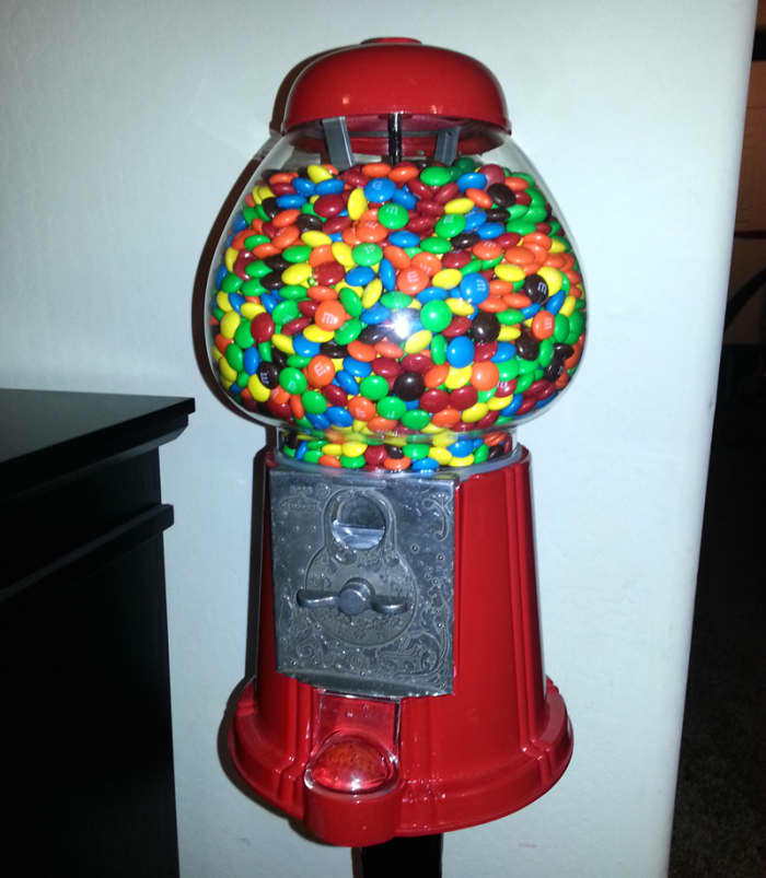 I recently purchased this King Gumball Machine for my kids. It holds about 5lbs of M&Ms (about 2,350 of them).
