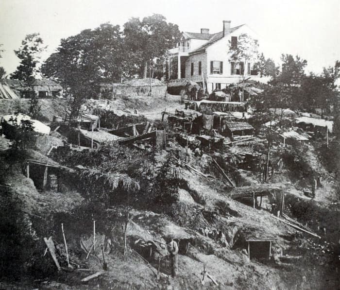 The Shirley family's home, shown during the siege, was inside Union lines at Vicksburg. Removed from the dangerously exposed house, family members found shelter in a cave.