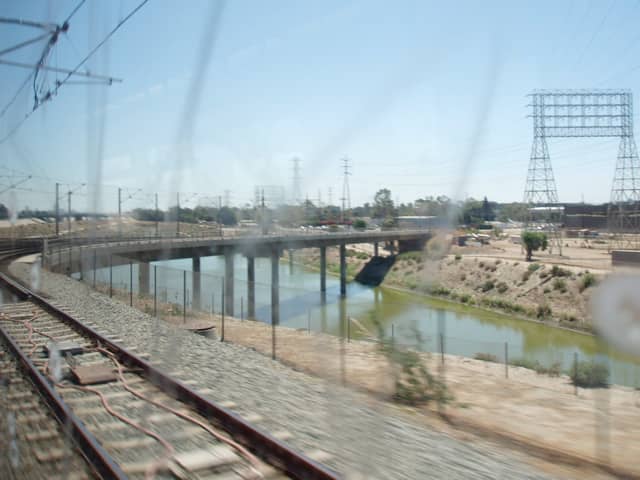 Los Angeles River as seen through the window of a subway train. Note the difference from its original, natural state pictured above.