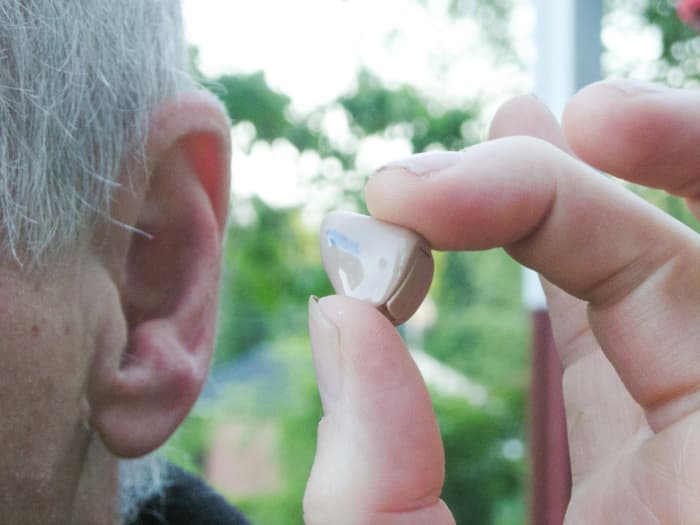 A hearing aid can prevent earwax from leaving the ear and cause it to collect inside the ear canal or the hearing aid.