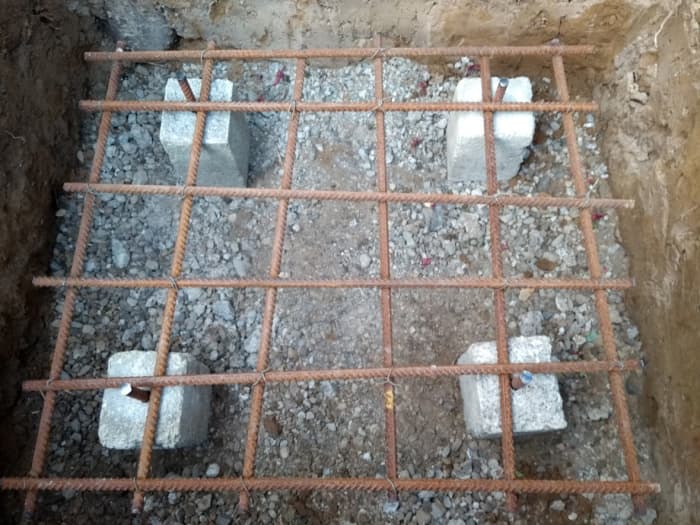 Grid in the footings of my gate pier. Note the concrete spacers I made to keep the grid suspended from the bottom of the foundation.