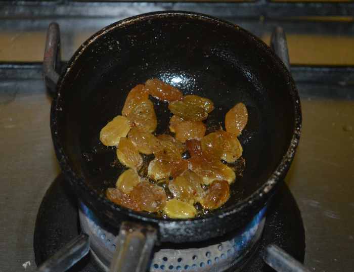 Step three: Adding a little ghee, saute the raisins. Add them to the same bowl.  