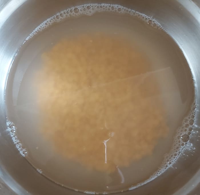 Rinse them well 2 to 3 times. Add water and soak it for 10 to 15 minutes (or more). Soaking will expedite the cooking process of lentils. You can skip the soaking step, if you prefer.
