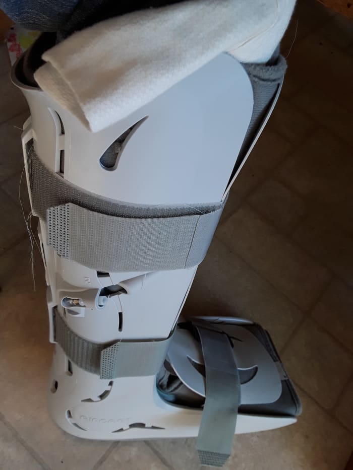This walking boot was from an injury DH incurred last year. Inflatable bladders on the inside made it fit me snuggly as well. The physician's assistants encouraged me to keep using it.