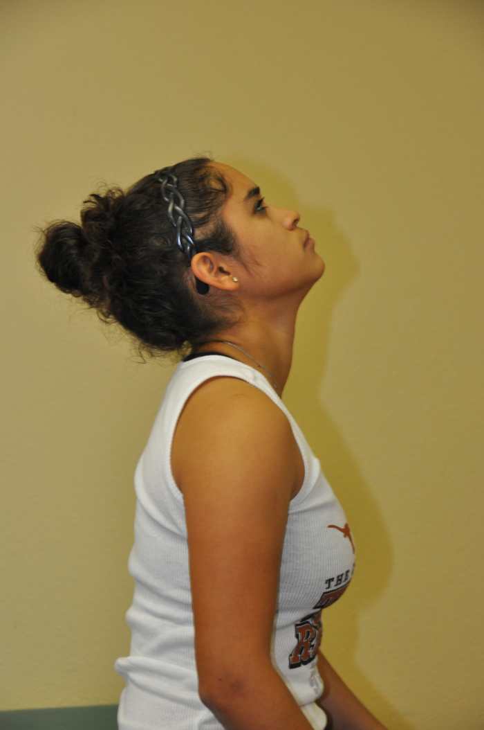 As though you are going to bend your head backward like this, but you won’t actually move your head. You should look like the first picture throughout.