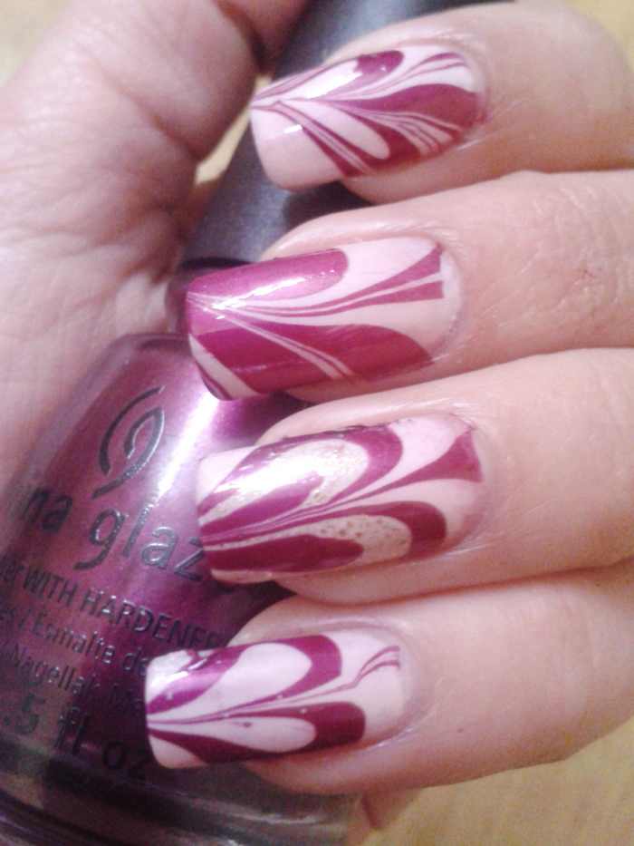 Heart nail art with water marble nail art technique