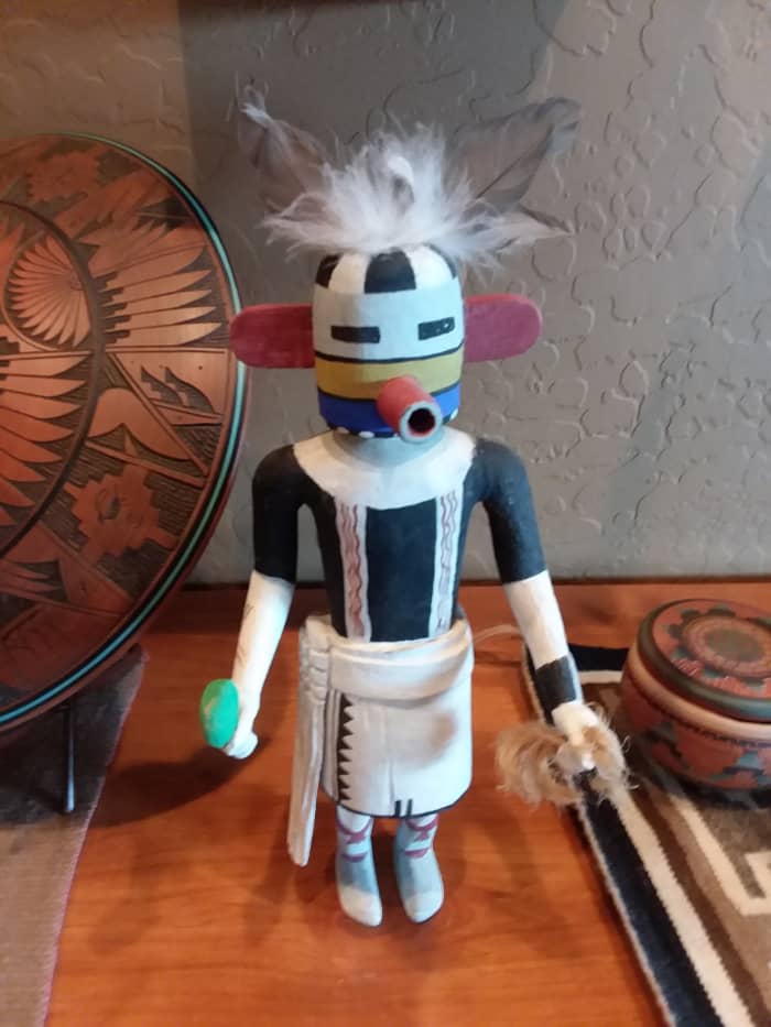Notice that this Kachina does not have a base, which means that there isn't an artist's signature at the bottom. Really old Kachinas did not have a base, but the feathers appear new. Unsure of origin.