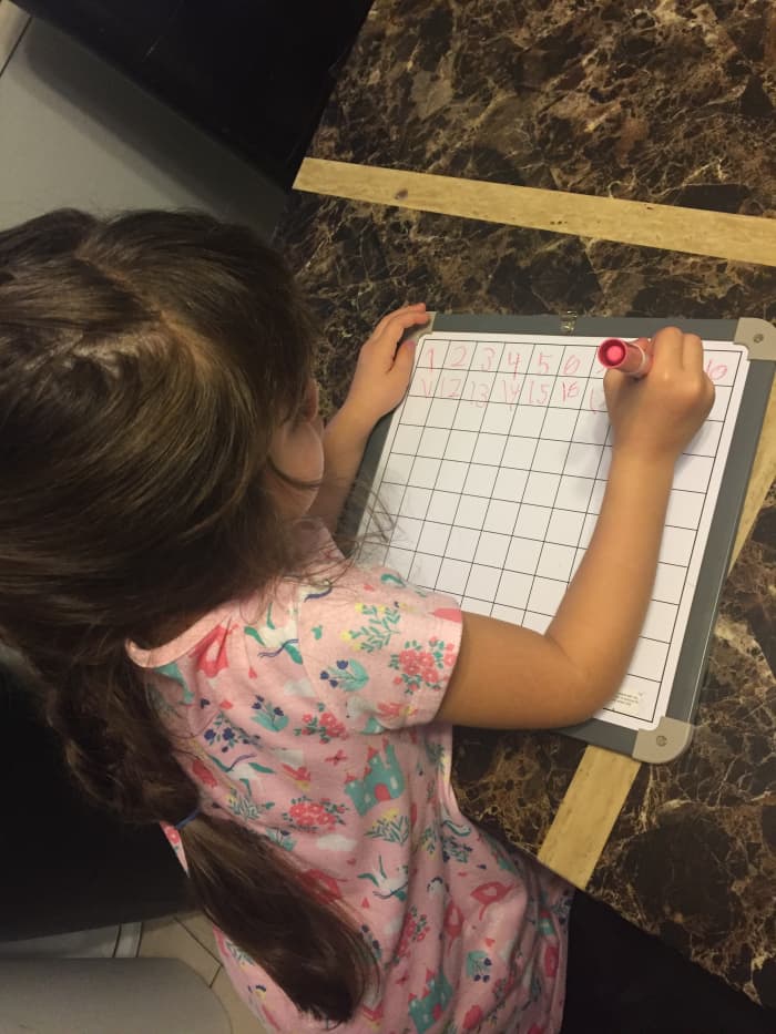 Practicing writing the numbers 1-100 is more fun on a slippery dry erase surface!